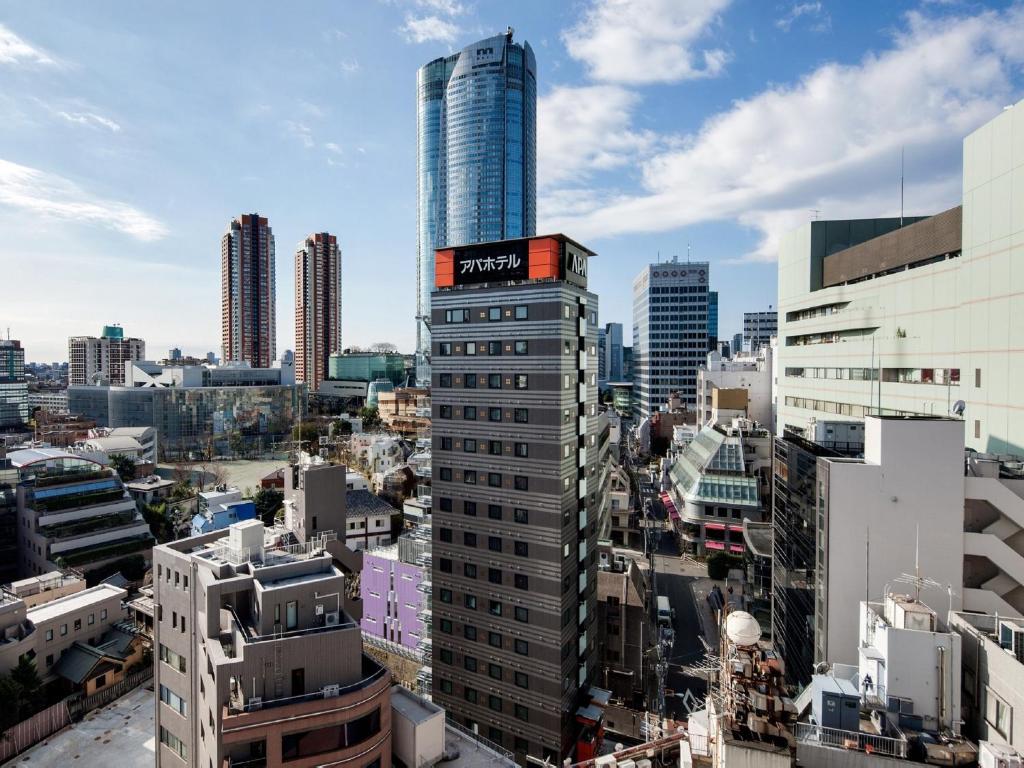 a city with tall buildings and lots of traffic at APA Hotel Roppongi Ekimae in Tokyo