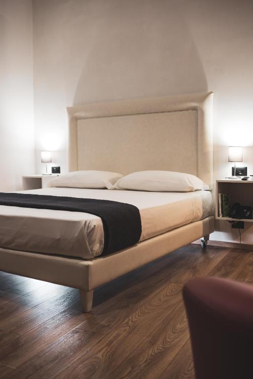 Postel nebo postele na pokoji v ubytování RESIDENZE CASSOLI - Lamezia Centro