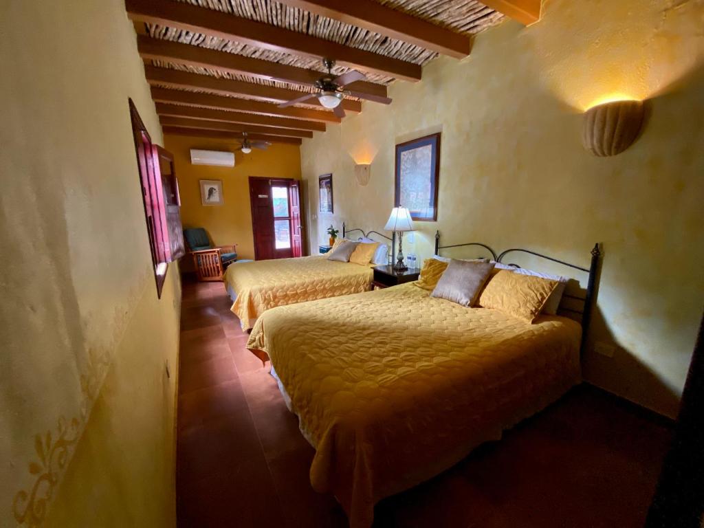 Postelja oz. postelje v sobi nastanitve Hotel Casa María Félix