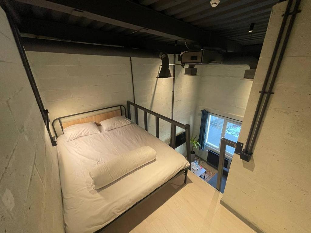 Postel nebo postele na pokoji v ubytování Campus Community A-Rooms