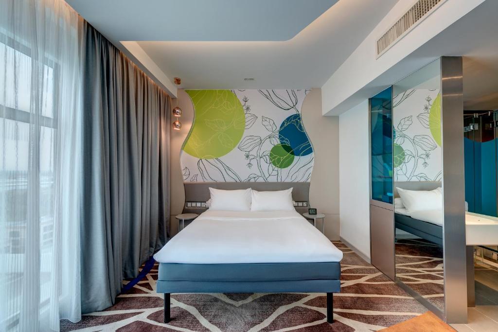 Llit o llits en una habitació de ibis Styles Johor Iskandar Puteri