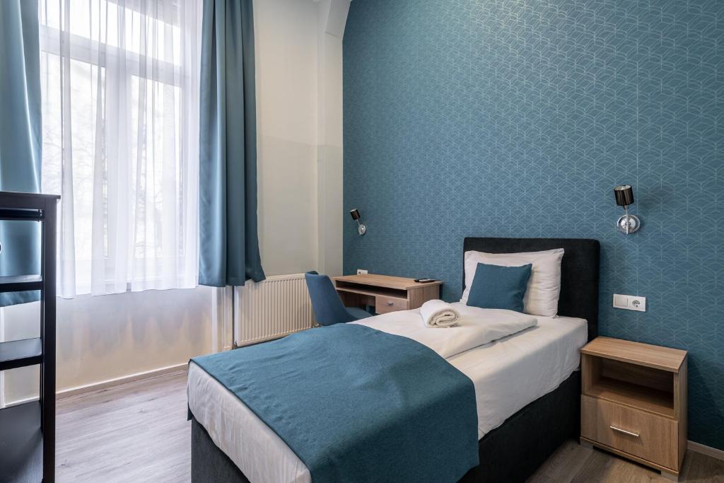 Postel nebo postele na pokoji v ubytování Full Moon Budapest