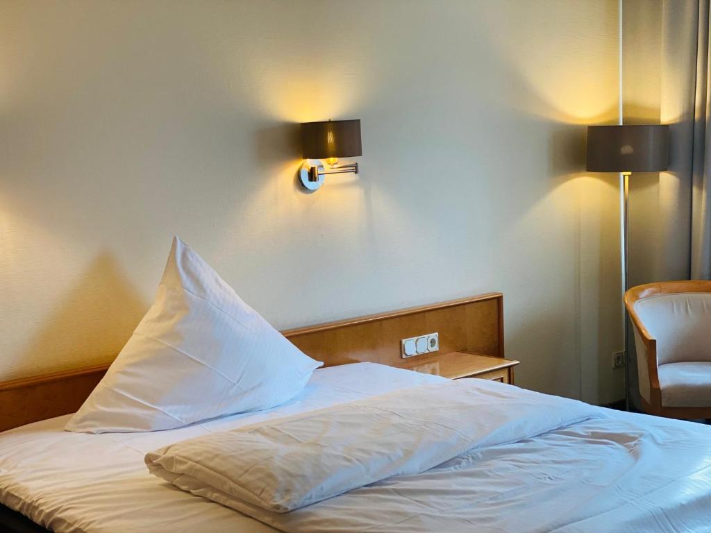 Postel nebo postele na pokoji v ubytování Meissmers Hotel