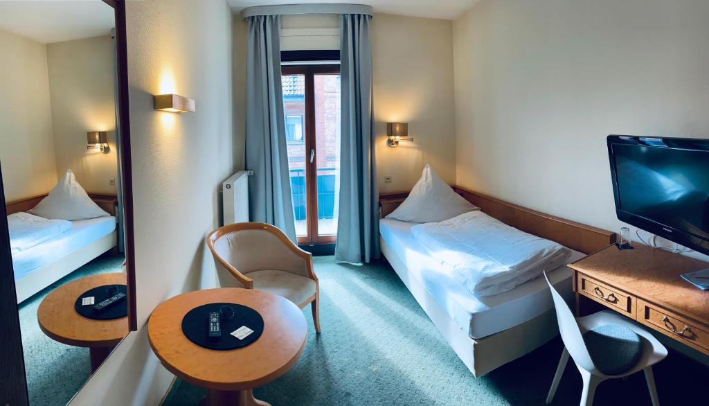Postel nebo postele na pokoji v ubytování Meissmers Hotel