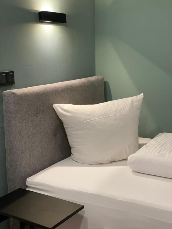 Postel nebo postele na pokoji v ubytování Meissmers Hotel