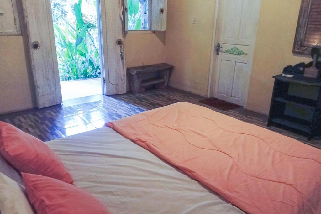 Postel nebo postele na pokoji v ubytování Pranajaya Villa