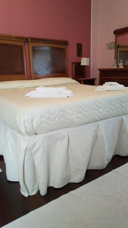 Postel nebo postele na pokoji v ubytování Corte Posta B&B - parcheggio e bagno in camera