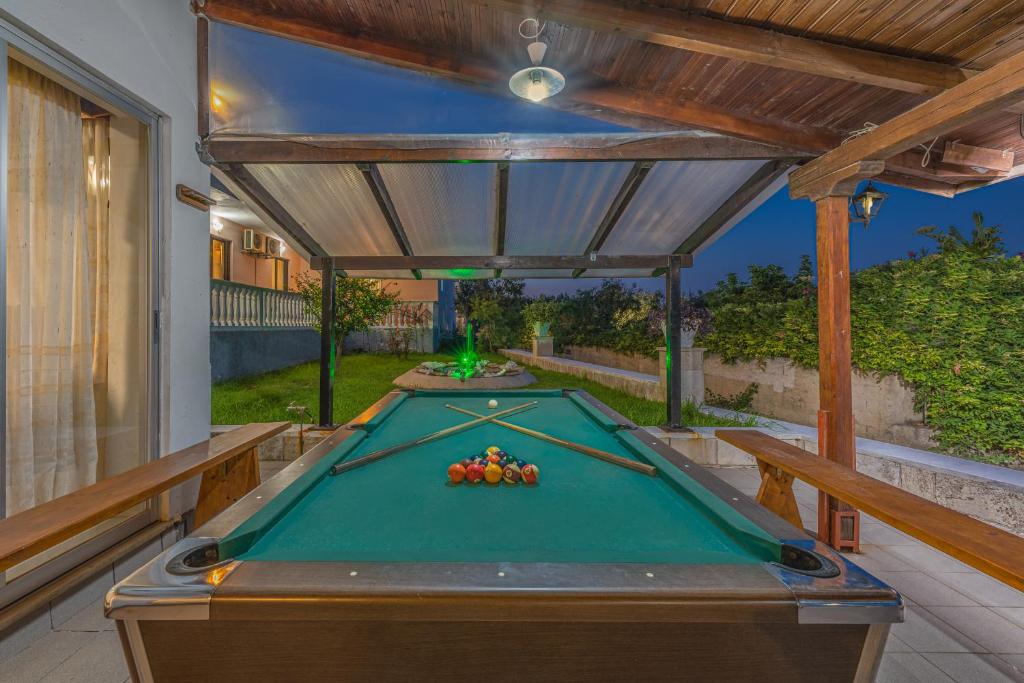 a pool table in the middle of a patio at Panorama in Laganas