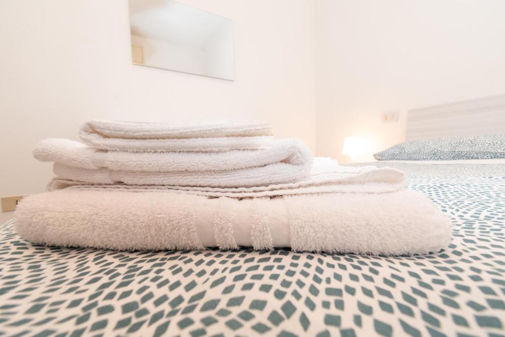A bed or beds in a room at Appartamento Ospedale Civile 3 - F&L Apartment