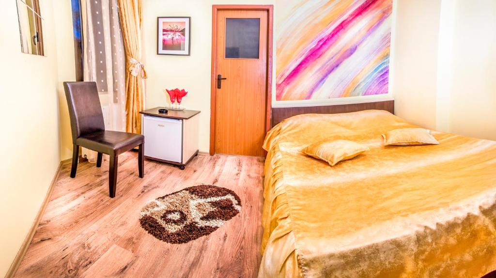 Postel nebo postele na pokoji v ubytování Hotel EOS
