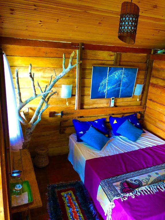Postel nebo postele na pokoji v ubytování Wilpattu Green Cabin