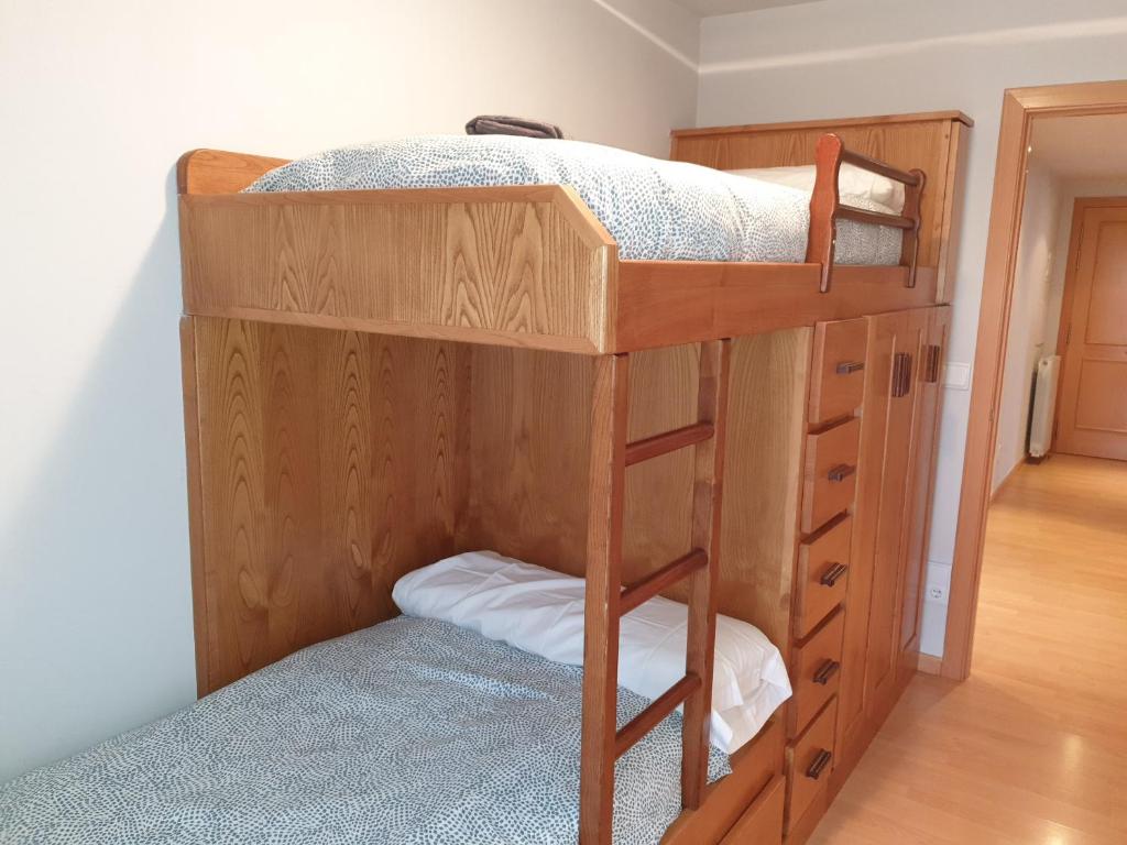 A bed or beds in a room at Apartamento Vive Jaca