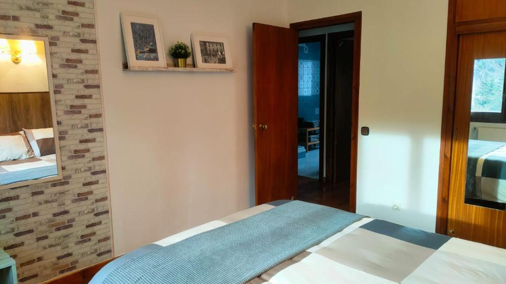 Postel nebo postele na pokoji v ubytování Apartament turistic Pont d’Ordino