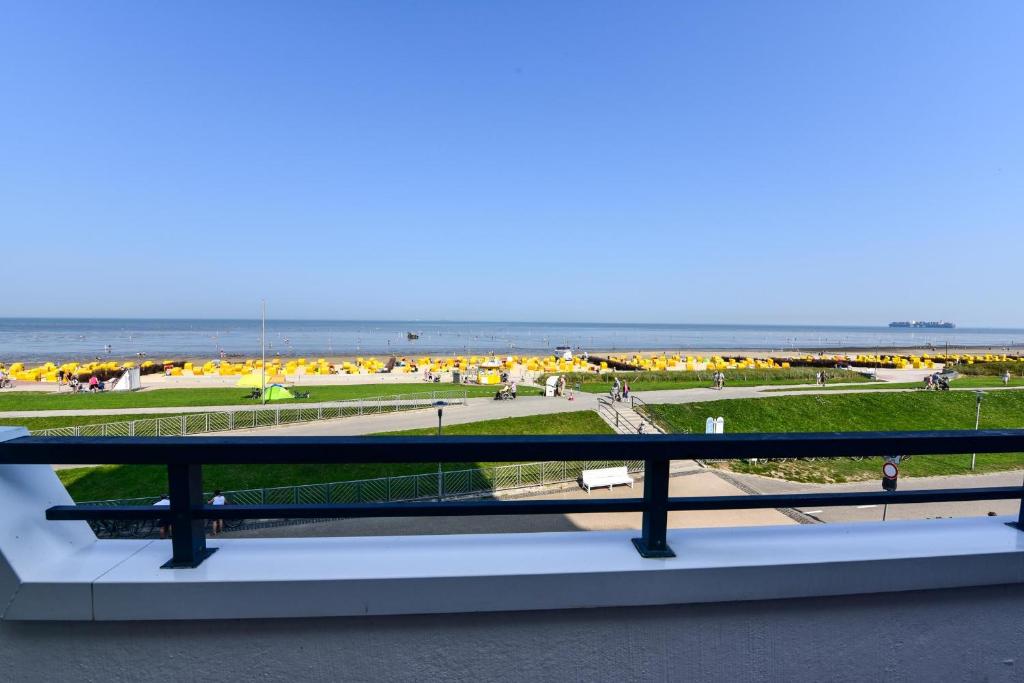 a view of the beach from the balcony of a building at Haus "Panorama" Appartement PAN024 in Duhnen