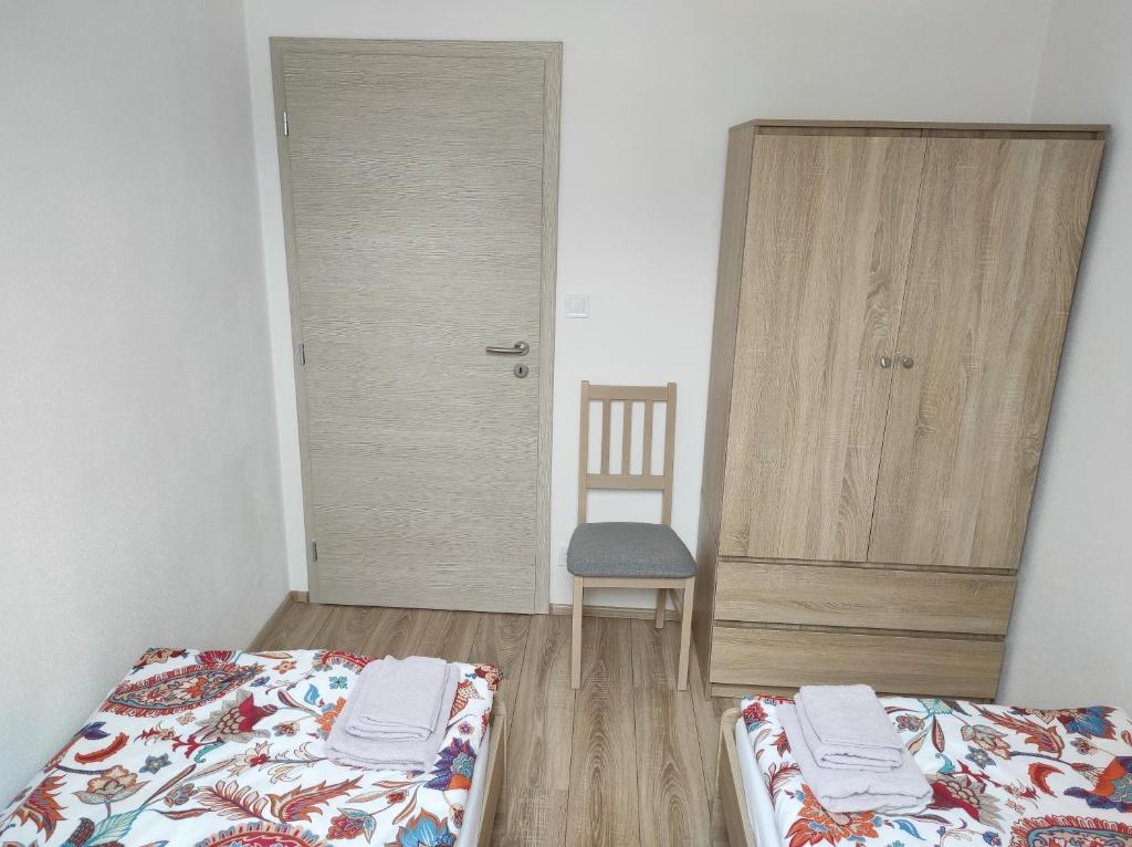 Postel nebo postele na pokoji v ubytování Apartmán Frymburk 700