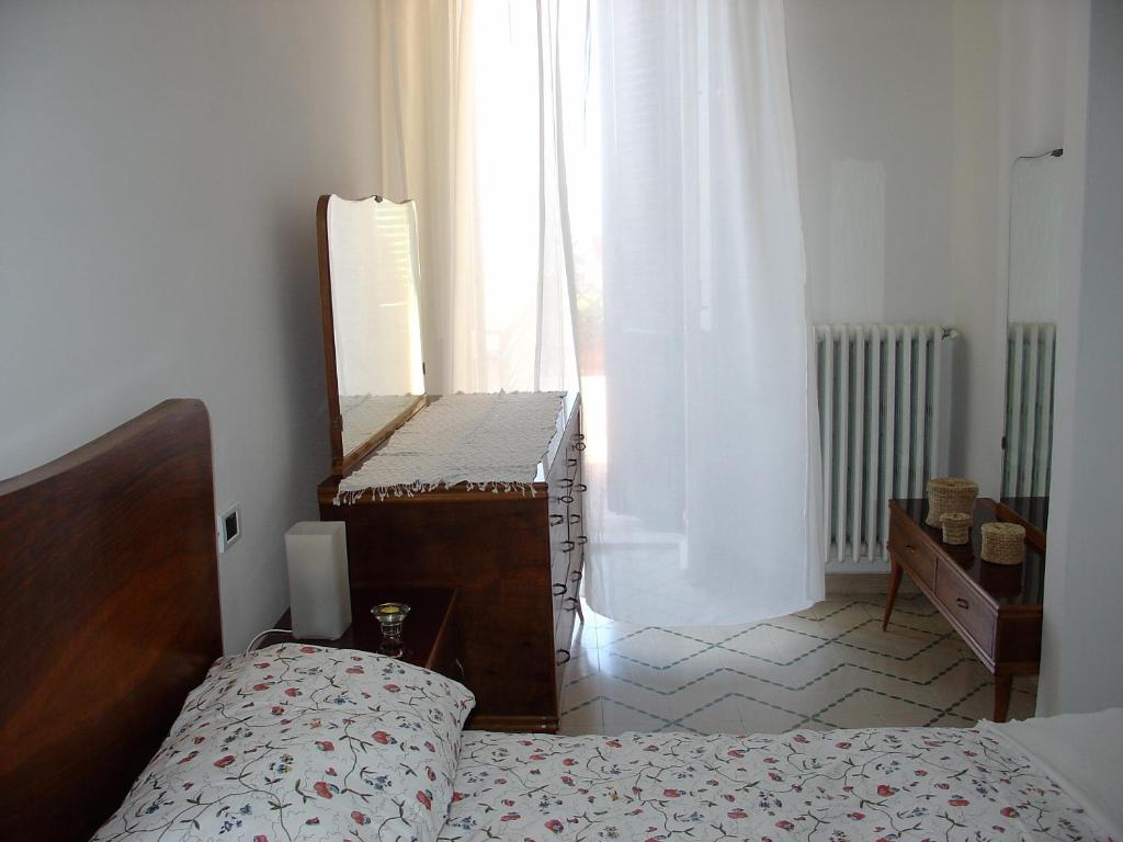 A bed or beds in a room at Maddalena House