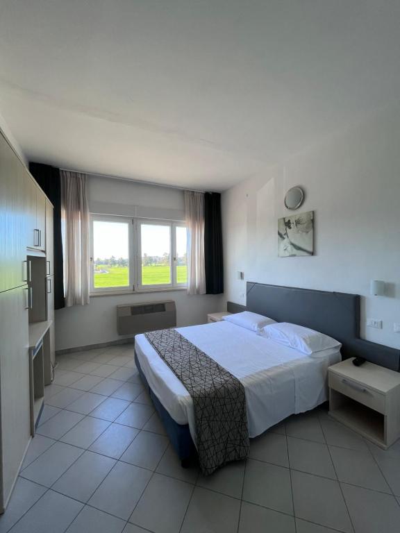 Postel nebo postele na pokoji v ubytování Hotel Letizia