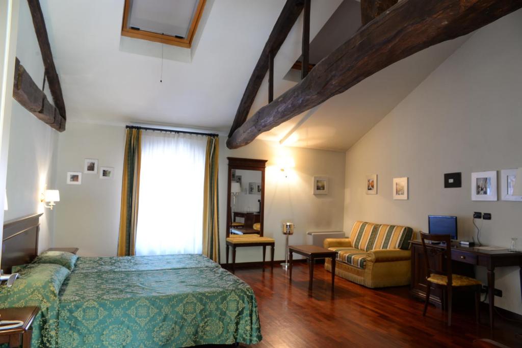 Postel nebo postele na pokoji v ubytování Villa Chiara Hotel