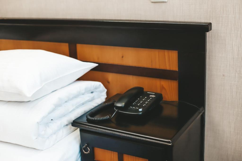 Postel nebo postele na pokoji v ubytování Georg Palace Hotel