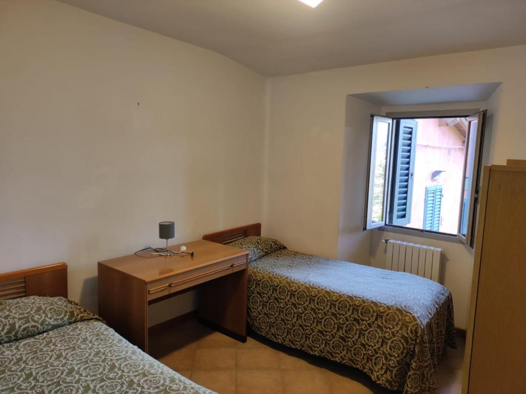 Posteľ alebo postele v izbe v ubytovaní QOELET - B&B Etico e Sociale