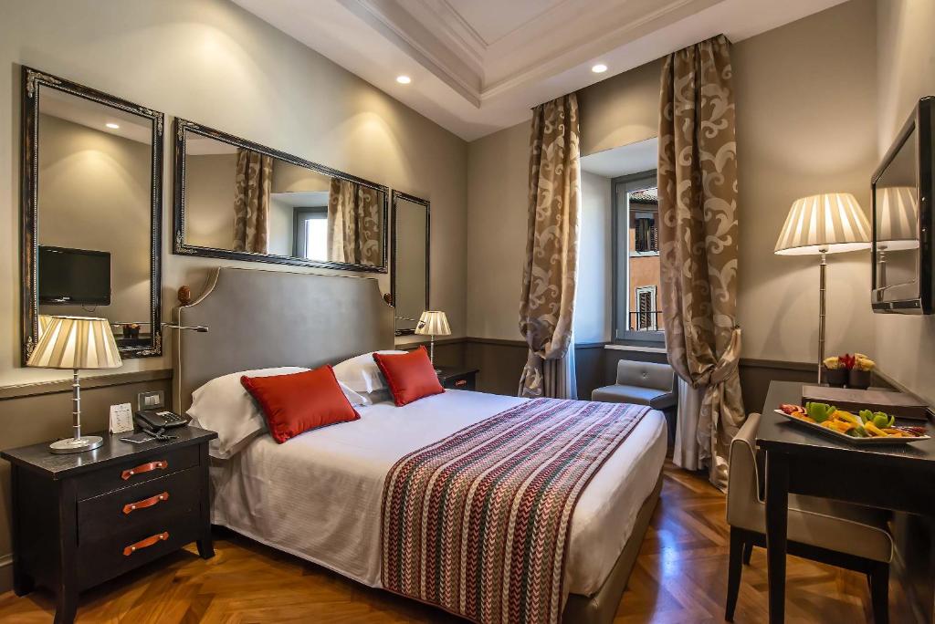 Postel nebo postele na pokoji v ubytování Hotel Lunetta