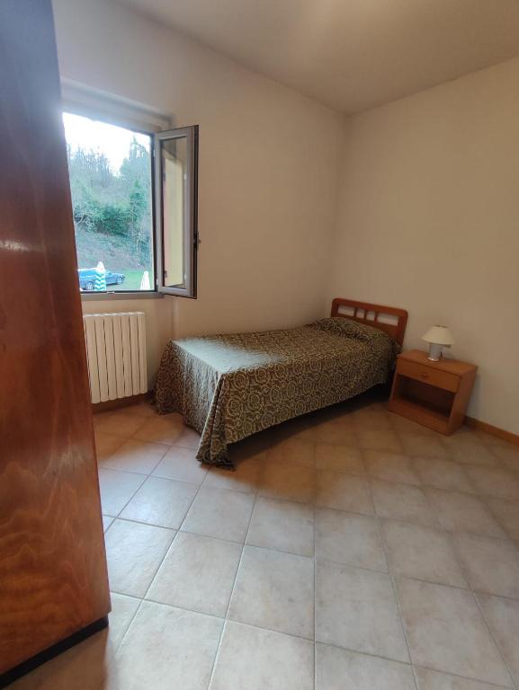 Posteľ alebo postele v izbe v ubytovaní QOELET - B&B Etico e Sociale