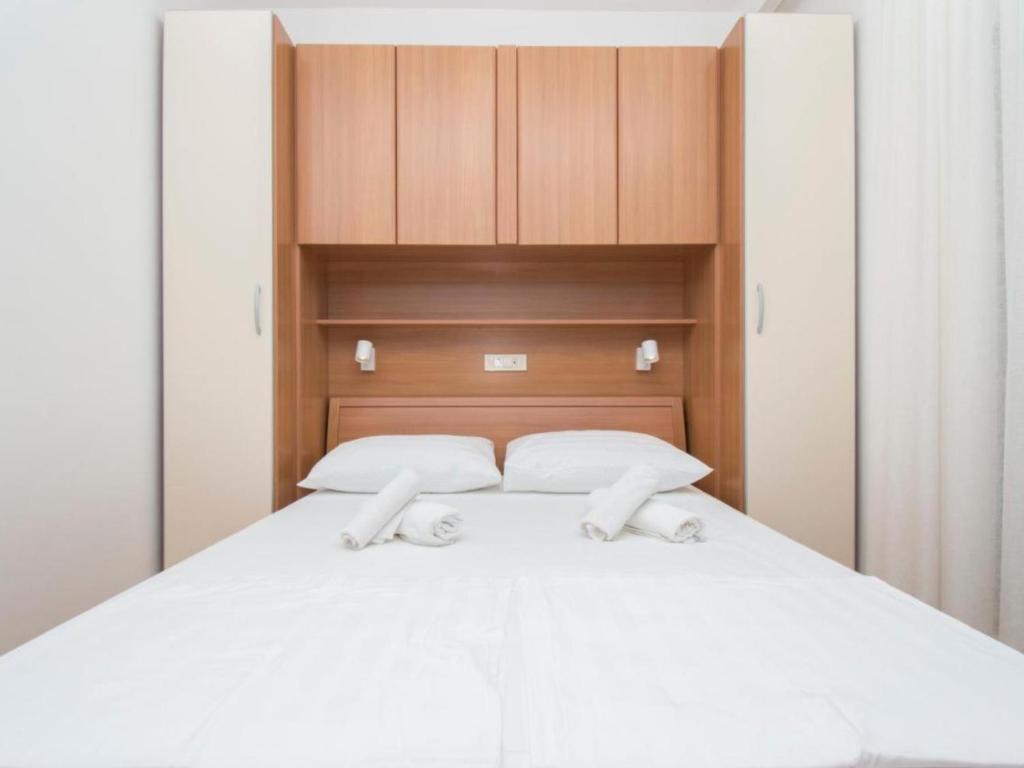 Postel nebo postele na pokoji v ubytování Apartments Antonio