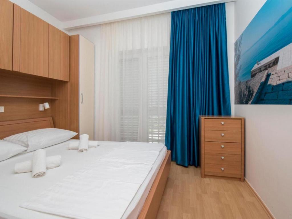 Postel nebo postele na pokoji v ubytování Apartments Antonio