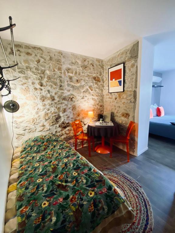 Postel nebo postele na pokoji v ubytování Pitibi Maison d'Hote