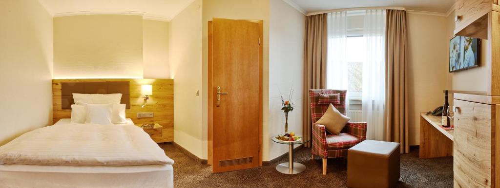 Postel nebo postele na pokoji v ubytování Hotel Weis