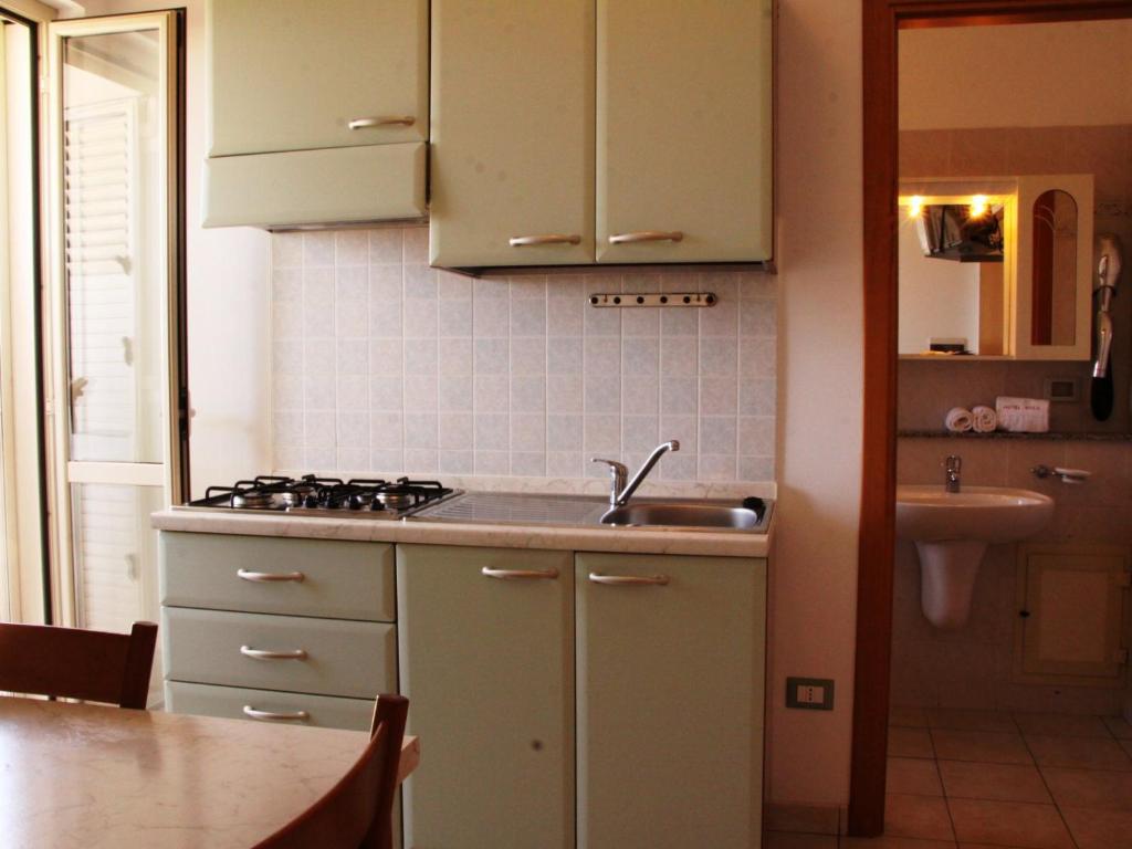 A kitchen or kitchenette at Graceland rooms and suites