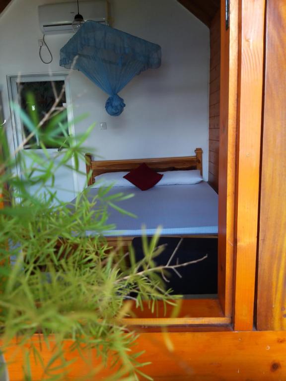 Postel nebo postele na pokoji v ubytování DOT BEY beach cabana