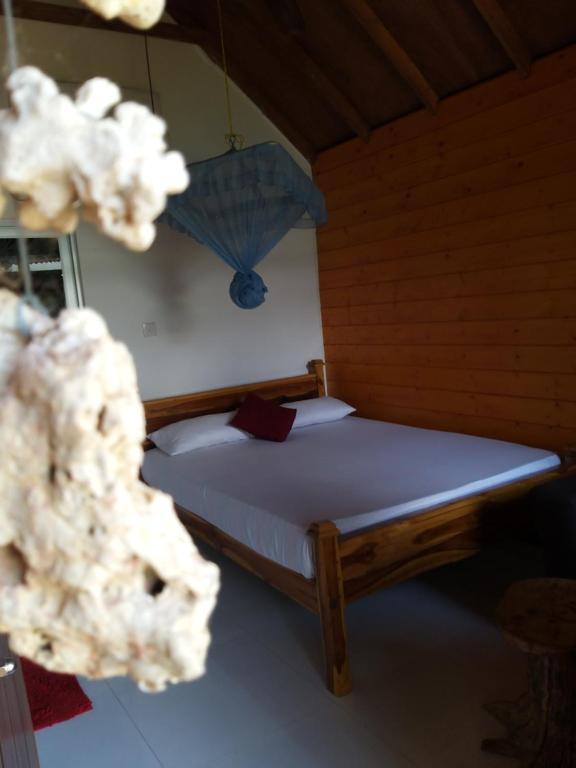 Postel nebo postele na pokoji v ubytování DOT BEY beach cabana