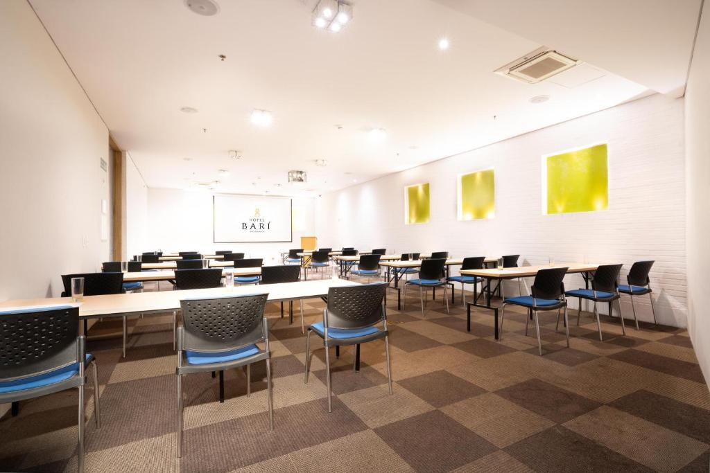 a large room with tables and chairs in it at Hotel Bari Bucaramanga in Bucaramanga