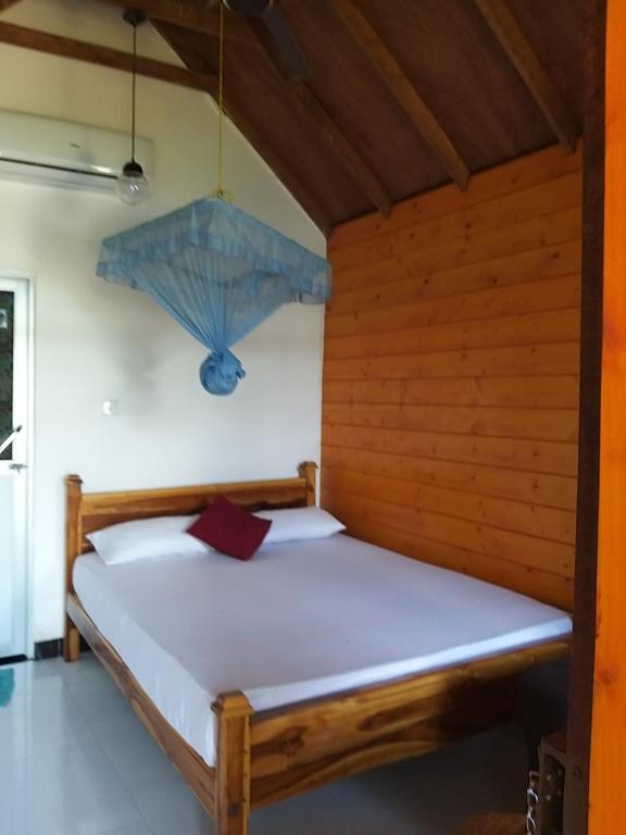 Postel nebo postele na pokoji v ubytování DOT BEY beach cabana