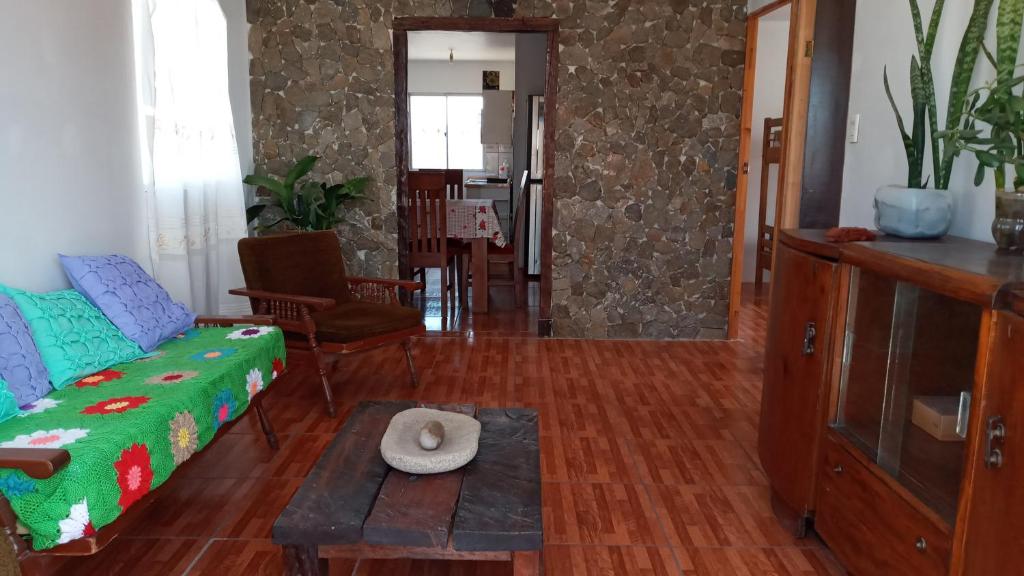 a living room with a couch and a table at Punta de choros Cabañas bahia carrizalillo in Carrizalillo