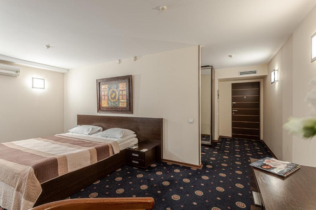 Postel nebo postele na pokoji v ubytování Incognito Boutique Hotel