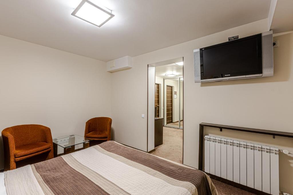 TV a/nebo společenská místnost v ubytování Incognito Boutique Hotel