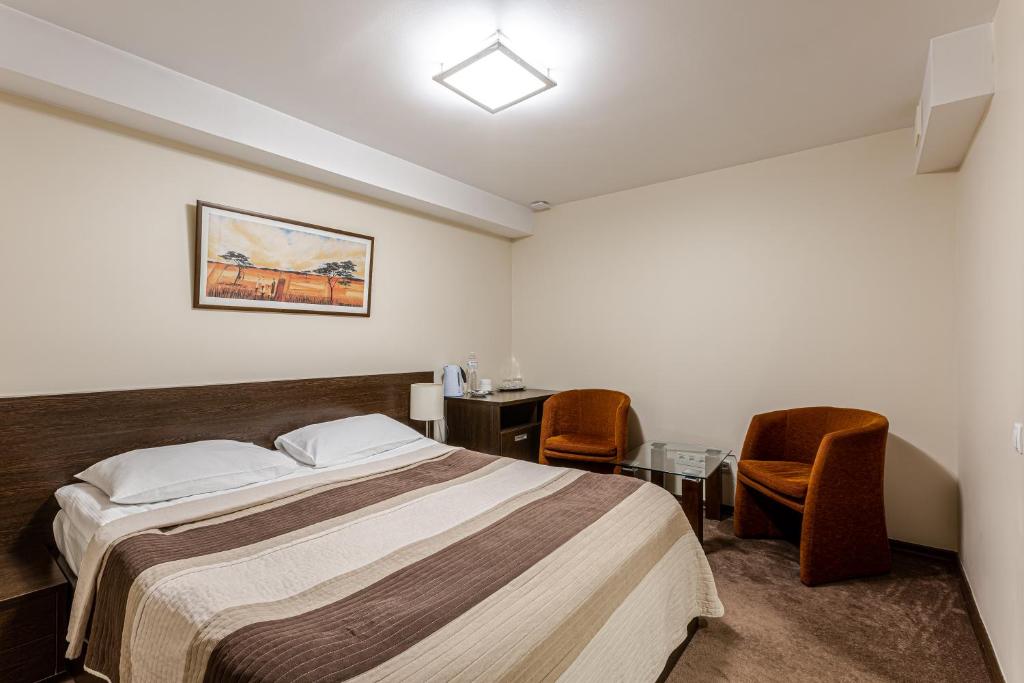 Postel nebo postele na pokoji v ubytování Incognito Boutique Hotel