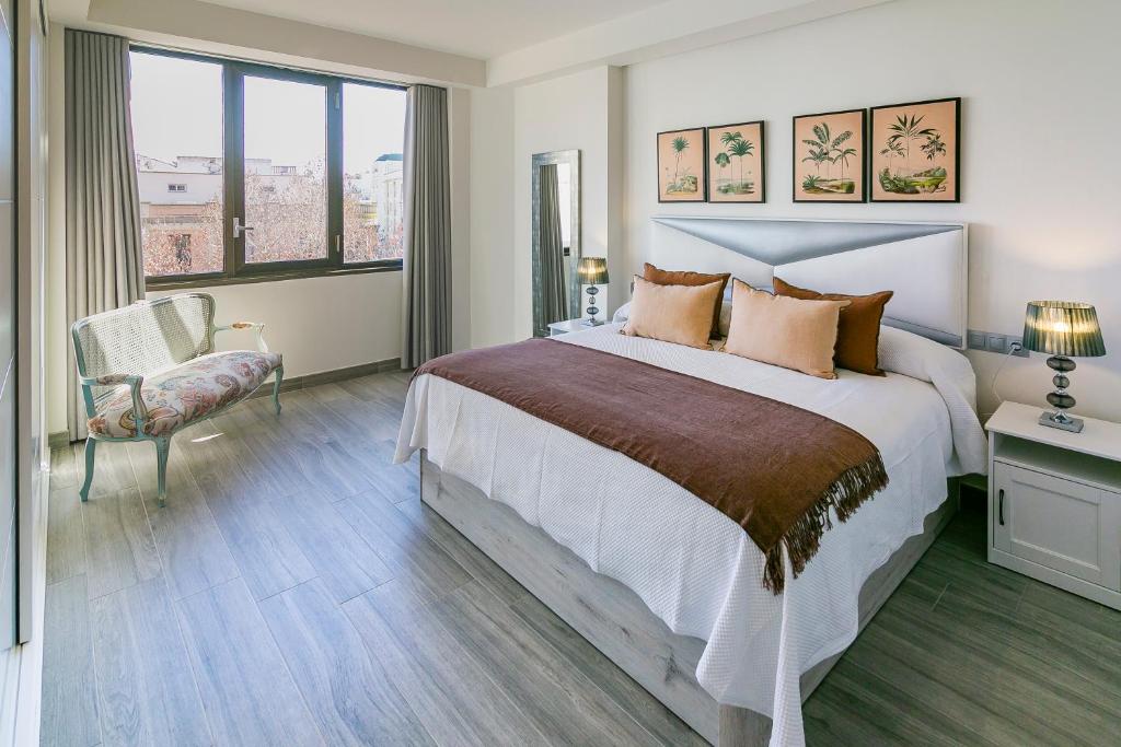 Postel nebo postele na pokoji v ubytování Apartamento Gran Capitán Uno