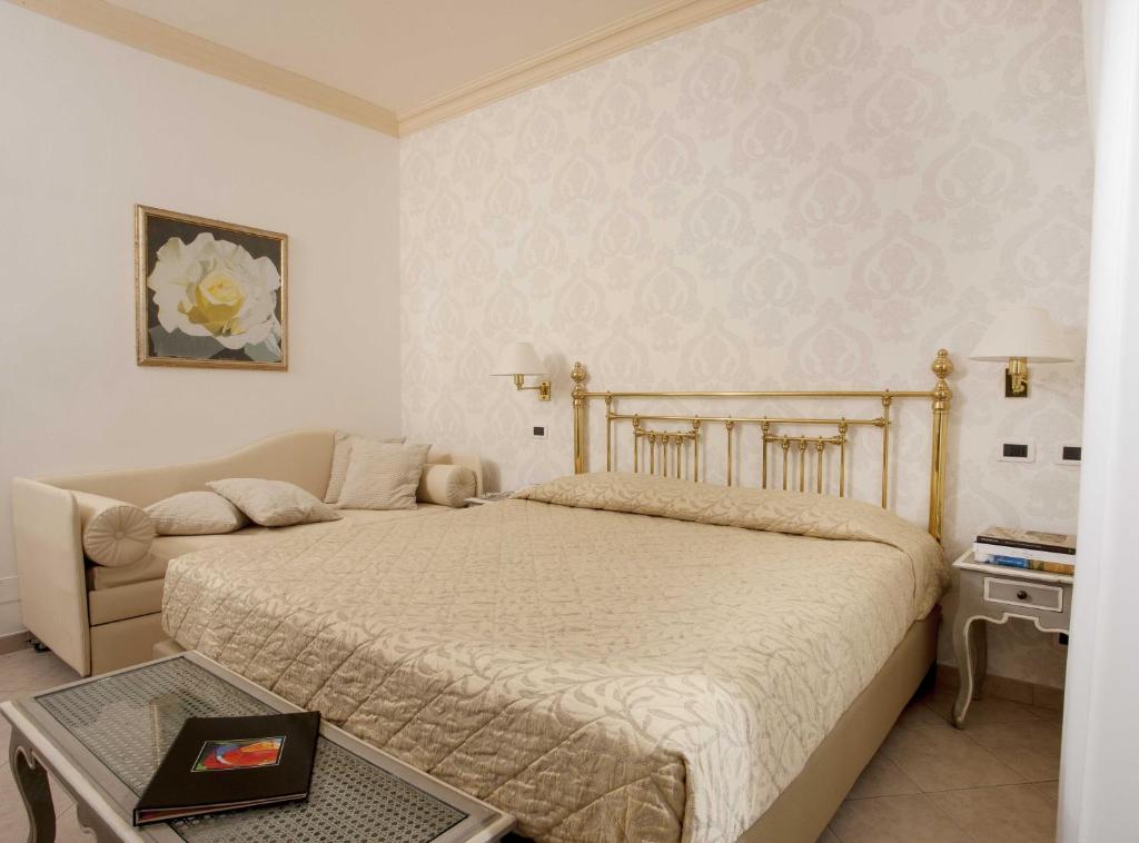 Postel nebo postele na pokoji v ubytování Hotel Posillipo