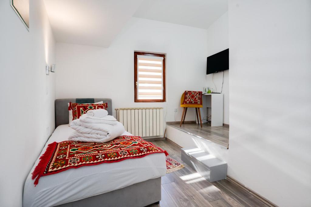 Postel nebo postele na pokoji v ubytování Hotel Vamos Sarajevo, b&b