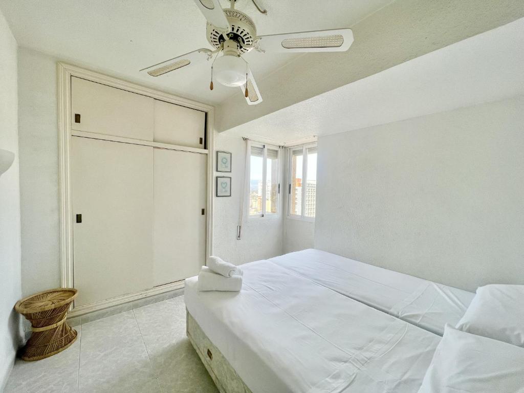 A bed or beds in a room at Caballos Apartment
