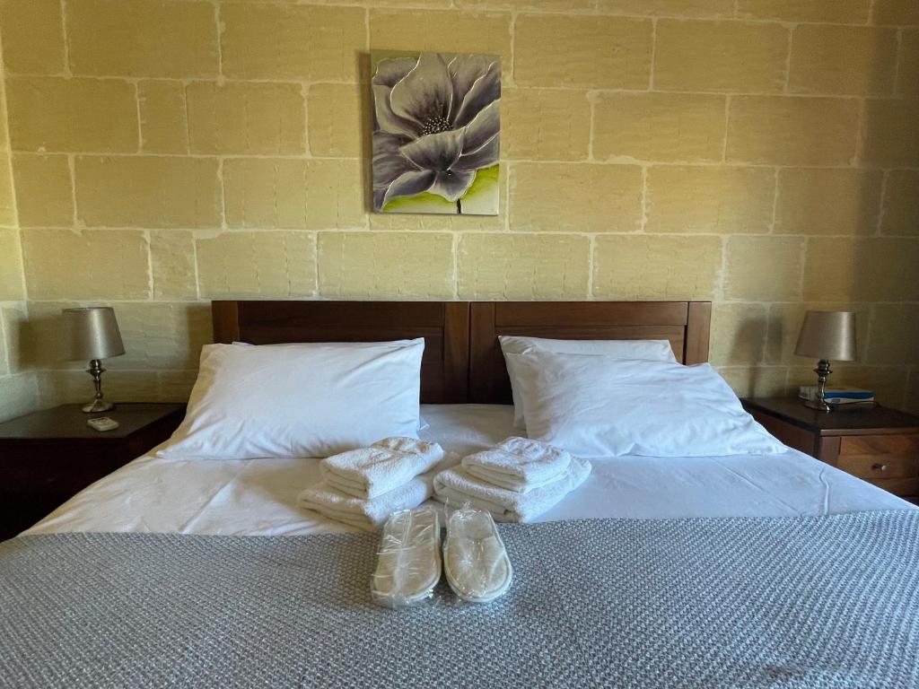 Postel nebo postele na pokoji v ubytování Gilju B&B