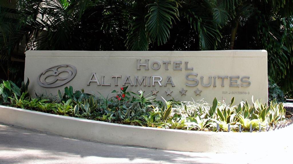 a sign for a hotel at atlatlantic suites at HOTEL ALTAMIRA SUITES in Caracas