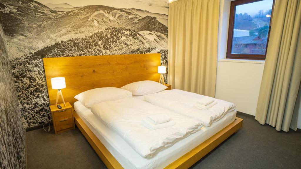 Postel nebo postele na pokoji v ubytování Apartman Bella