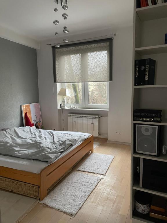 Posteľ alebo postele v izbe v ubytovaní Apartament Koszykowa 1