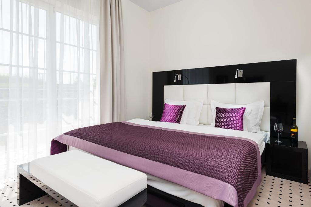 Posteľ alebo postele v izbe v ubytovaní Apartamenty M&M
