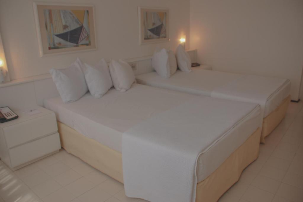 Cama ou camas em um quarto em Rede Andrade LG Inn
