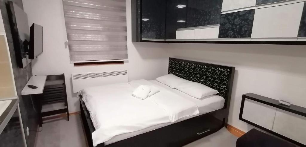Ліжко або ліжка в номері Apartman De lux Zlatibor